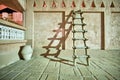 Wooden ladder casting shadow at night time