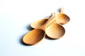 Wooden ladles on white background.