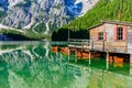 Wooden lake house at Lake Braies also known as Pragser Wildsee in beautiful mountain scenery. Amazing Travel destination Lago di