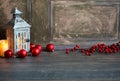 The wooden lampion with red christmas decorations and candles