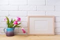 Wooden landscape frame mockup with pink tulip in purple pitcher