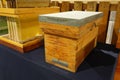 Wooden langstroth beehive and observation hive display Royalty Free Stock Photo