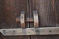 Wooden latch for locking the ancient door leaves