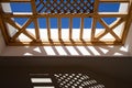 Wooden lattice and its Shadow on a wall. Straight view. Royalty Free Stock Photo