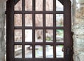 Wooden latticed door closes the entrance to the courtyard.