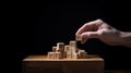 Wooden letter cubes holding with fingers, spelling connection and unity.