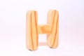 Wooden letter h carved from wood with a beautiful wood texture