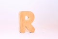 Wooden letter r carved from wood with a beautiful wooden texture Royalty Free Stock Photo