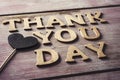 Wooden letters forming the text thank you day