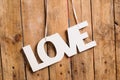 Wooden letters forming word LOVE written on wooden background