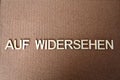 Wooden letters forming the words Auf Widersehen in German