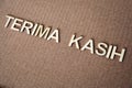 Wooden letters forming the words Terima Kasih in Indonesian