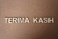 Wooden letters forming the words Terima Kasih in Indonesian Royalty Free Stock Photo