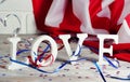 Wooden letters are laid out in the word love, July 4, happy independence day, patriotism, memory of veterans, the concept