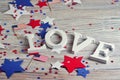 Wooden letters are laid out in the word love, July 4, happy independence day, patriotism, memory of veterans, the concept