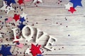 Wooden letters are laid out in the word love, July 4, happy independence day, patriotism, memory of veterans, the concept