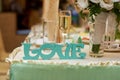 Wooden letters love on wedding table bride and groom Royalty Free Stock Photo