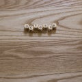 Wooden letters spelling October on a wooden background