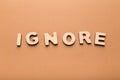 Wooden letters spelling word Ignore