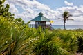 Wooden lifeguard station on Boca Raton beach with warning flags, Florida, USA