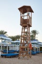 Wooden lifeguard tower on the sand beach. Royalty Free Stock Photo