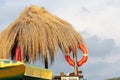 Wooden lifeguard tower at the seaside resort. Beach, parasols. Royalty Free Stock Photo