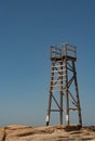 Wooden lifesaving tower with blue sky background on Royalty Free Stock Photo