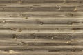 Wooden lining boards wall. midtone brown wood texture. background old panels, Seamless pattern. Horizontal planks Royalty Free Stock Photo