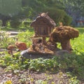 Wooden little house of a fabulous creature in the park in summer Royalty Free Stock Photo