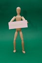 Wooden little man stands, sits Royalty Free Stock Photo