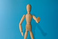 Wooden little man stands, sits Royalty Free Stock Photo