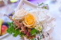 Wooden little white houses with flower arrangements