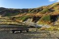 The Wooden Log Bench And A Mountain River