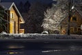 Wooden log cabin at winter night. Country house in winter evening can be used as postcard, wallpaper or poster Royalty Free Stock Photo