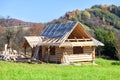 Wooden log house under construction. Highlander architecture Royalty Free Stock Photo