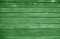 Wooden log house wall texture in green tone Royalty Free Stock Photo