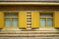 Wooden log house. Window with shutters of a wooden house Royalty Free Stock Photo