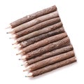 Wooden logs handmade colored pencils isolated