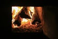 Wooden logs in oven fire, open damper