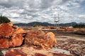 Wooden logs of pine woods stacked in a pile in the village of Sayward in Canada. Selective focus Royalty Free Stock Photo