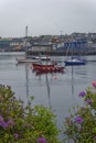 A wooden Longship and Yachts moored up in the Port of Stornoway on the Isle of Lewis in the Hebrides