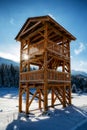 Wooden lookout on snowy winter country