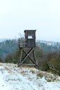 Wooden lookout tower for hunting in the woods and on meadow Royalty Free Stock Photo