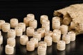 Wooden lotto barrels and bag on a dark wooden table. Close up