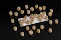 Wooden lotto barrels and card for playing on a black table