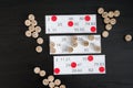 Wooden lotto barrels, cards and chips for playing on a black table