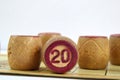 Wooden lotto barrels with numbers. Isolated on a white background. Family bingo game. Conceptual photo.