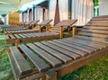 Wooden lounge chairs to stand in a row Royalty Free Stock Photo
