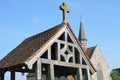 Wooden lychgate with church Royalty Free Stock Photo