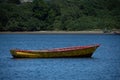 Wooden made fishing boat anchored at sea